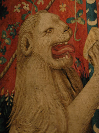 Tapestry image of lion.
